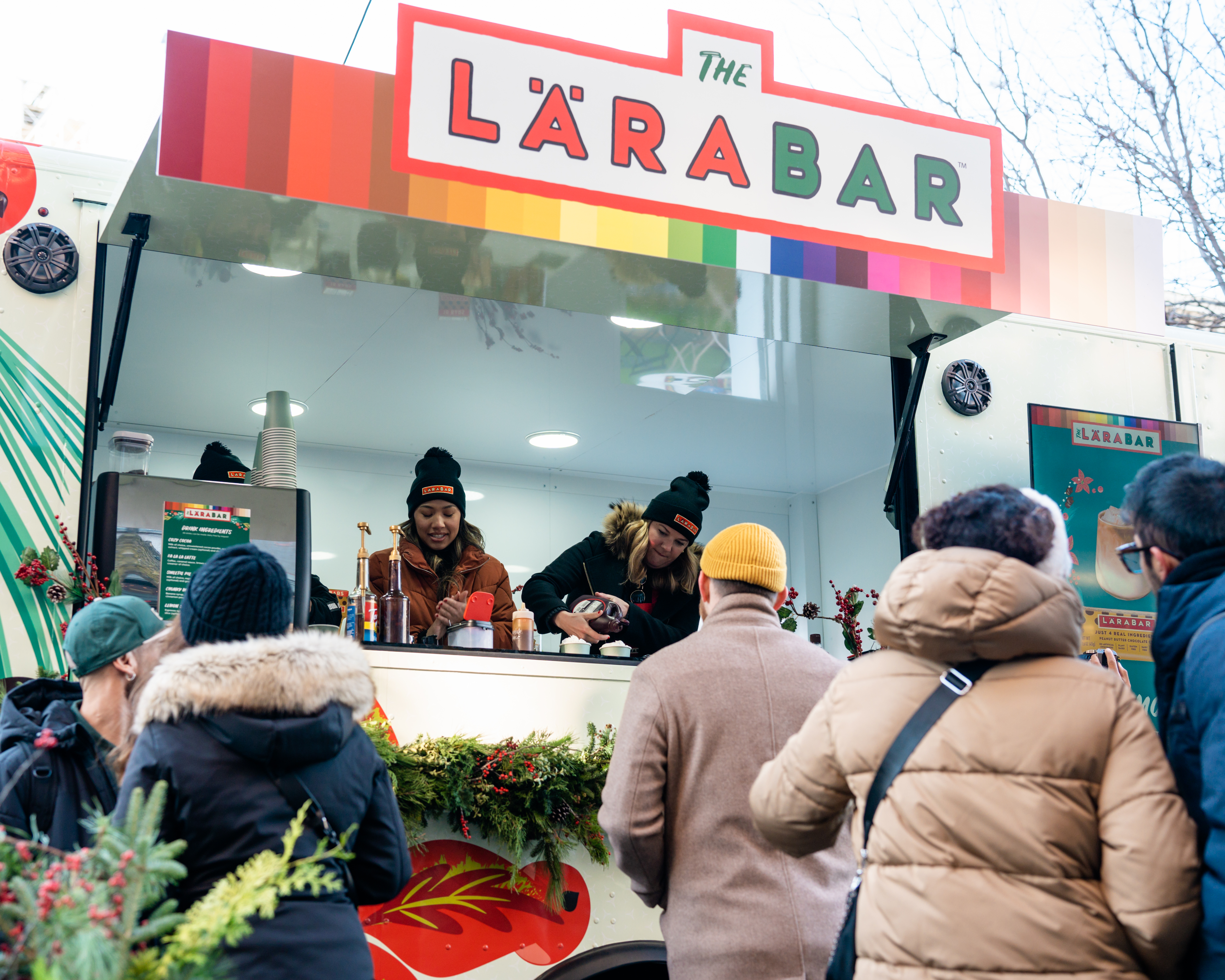 Pedestrians lining up at the Larbar coffee truck