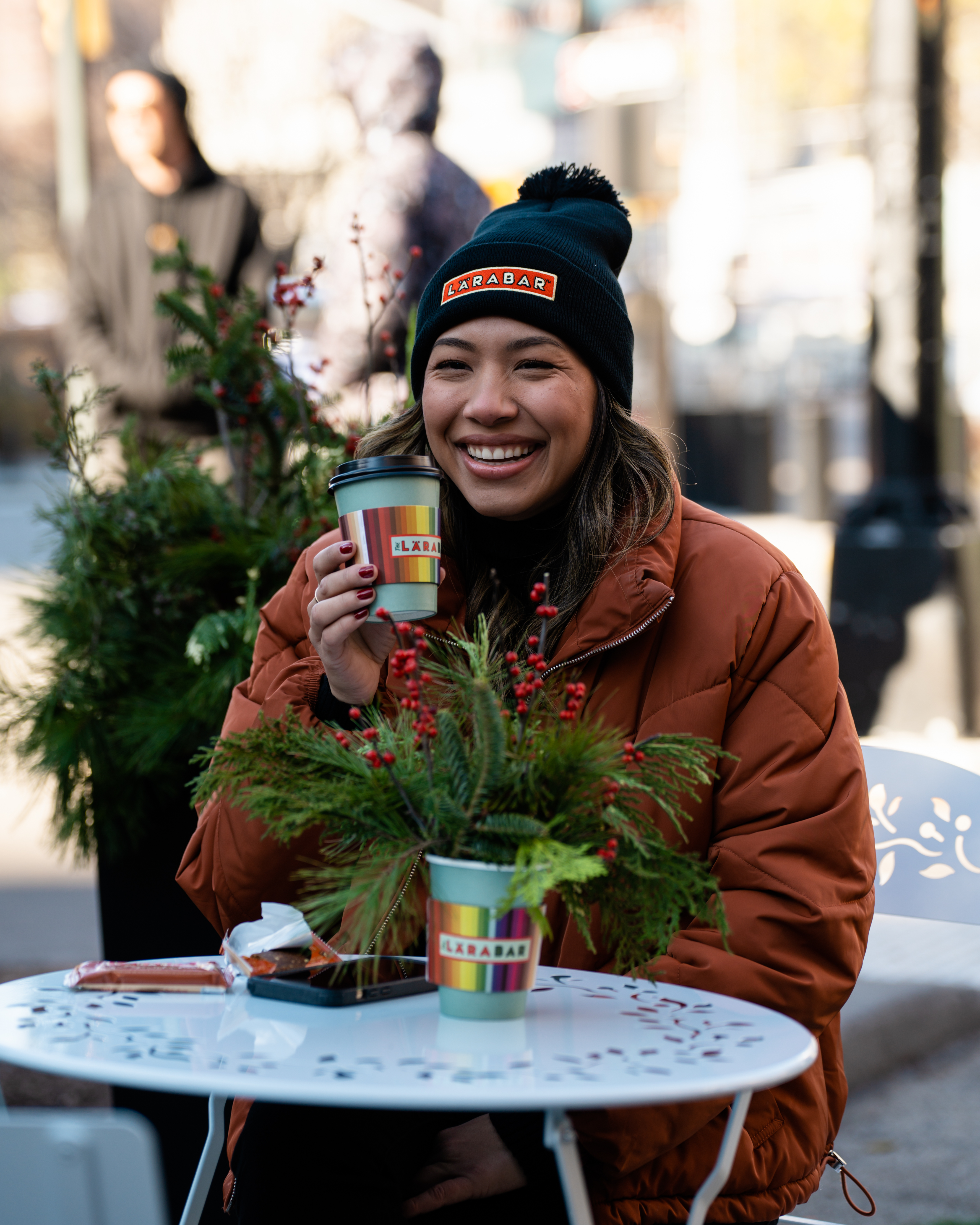 Asia holding a coffee cup and smiling
