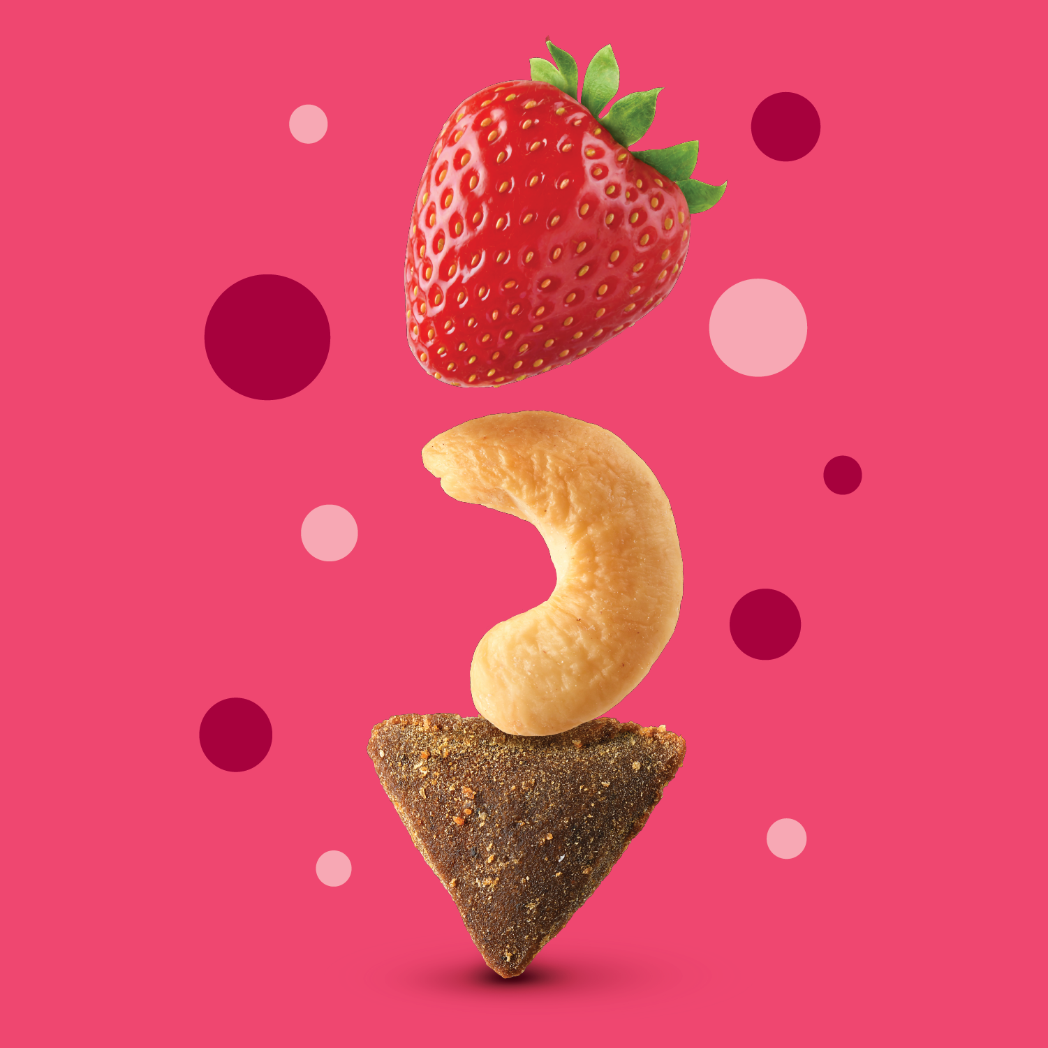 Pink graphic with a strawberry, cashew and apple on top of each other