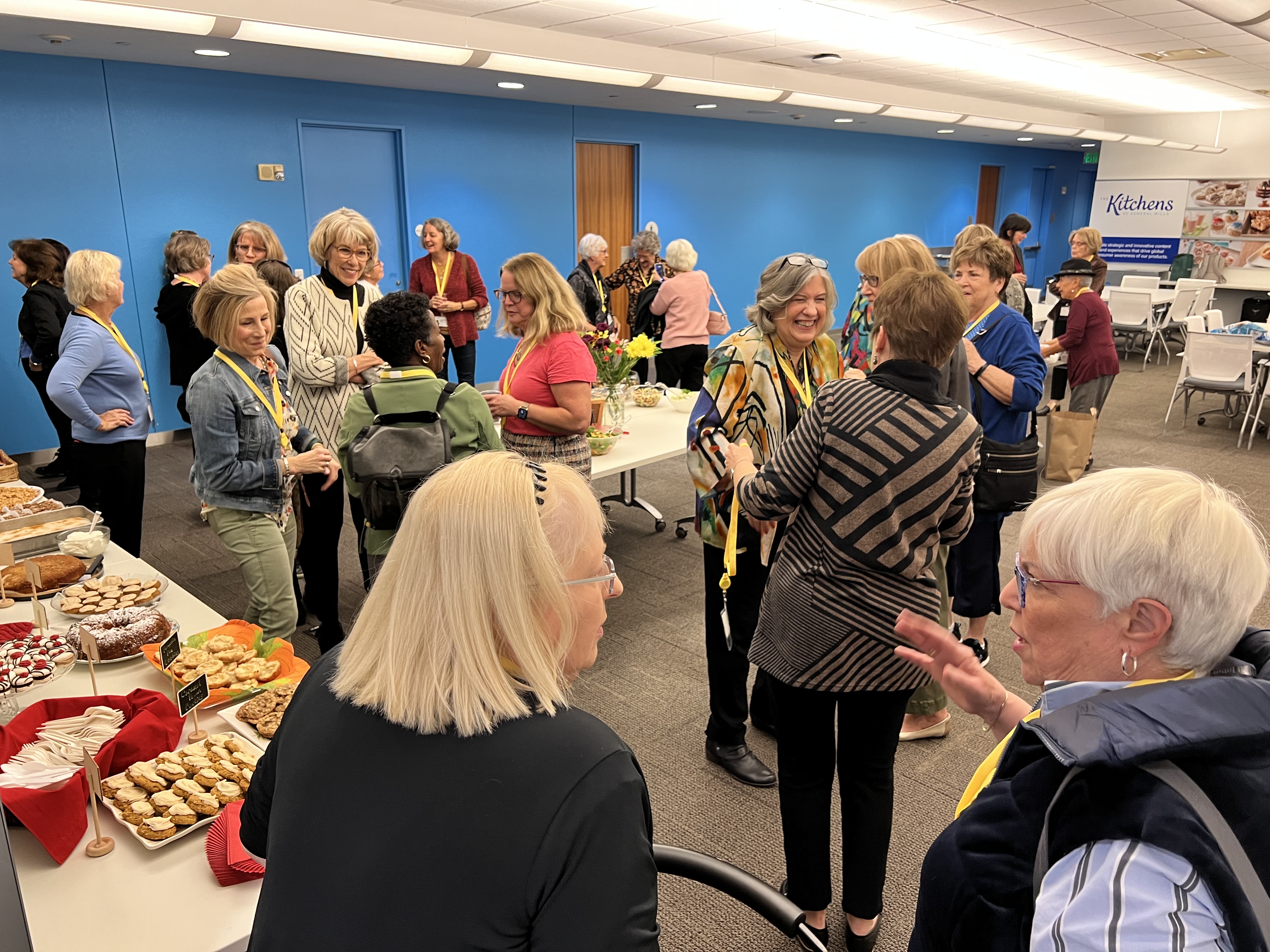 Women mingling in the Betty Crocker Kitchens 
