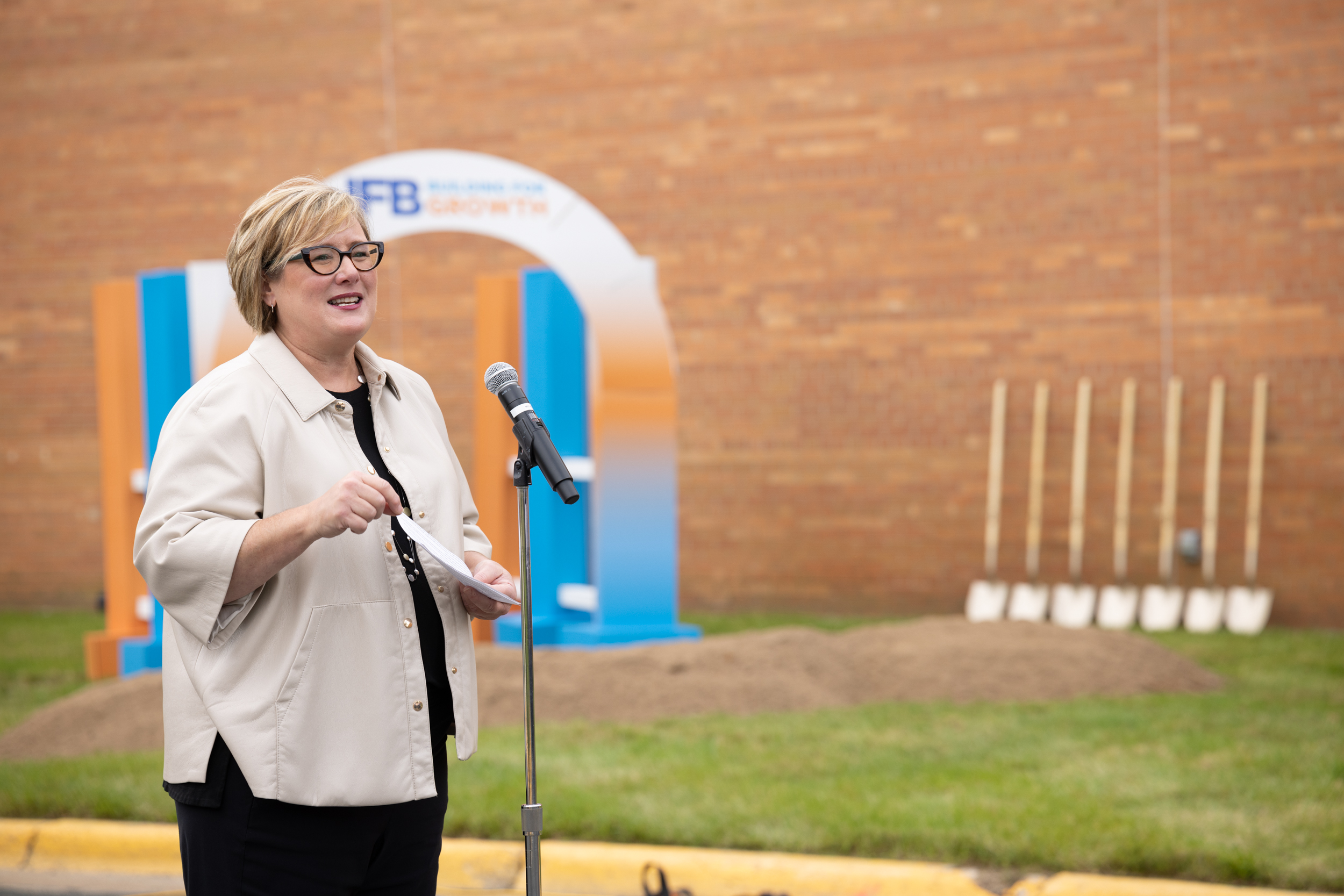 Woman speaking into a microphone